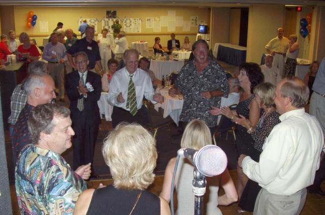 Brent Primus (Hawaiian shirt), Joel Seltz (in suit), Gerry Clark (white shirt & necktie), Dave Taylor, Lynn Lubov, Paul Sand (white shirt)